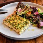 CAPTION: Sheet-pan quiche Lorraine from Hawks Provisions + Public House. Photo by Debbie Cunningham