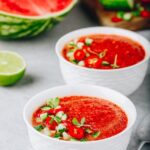 Watermelon and Tomato Gazpacho in white bowls. Traditional Spanish cold soup.