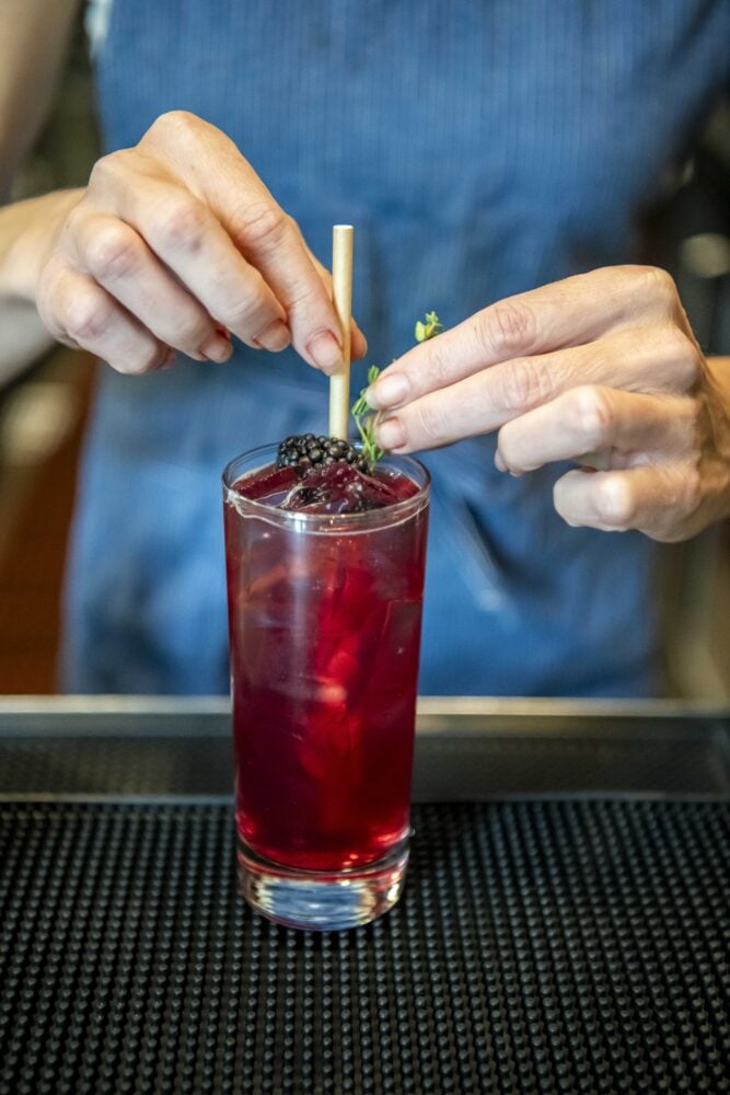 Cocktail made with a blackberry shrub.