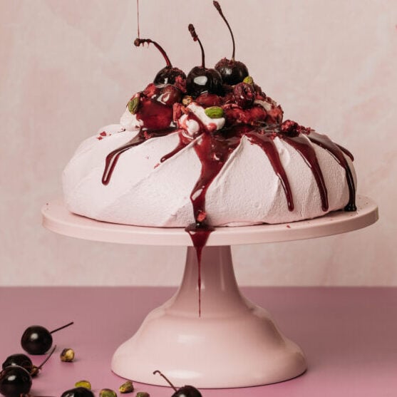 Sour Cherry Pavlova with cherries jubilee and cherry yogurt cream.