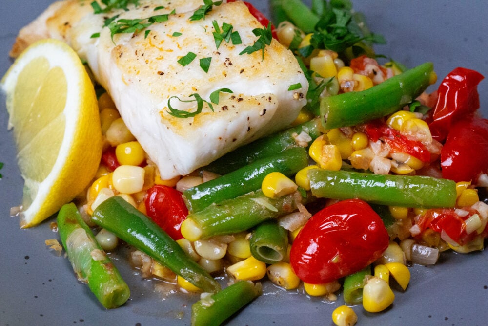 Succotash Halibut made with sweet summer and vine ripe tomatoes. Photo by Anastasia Murphy