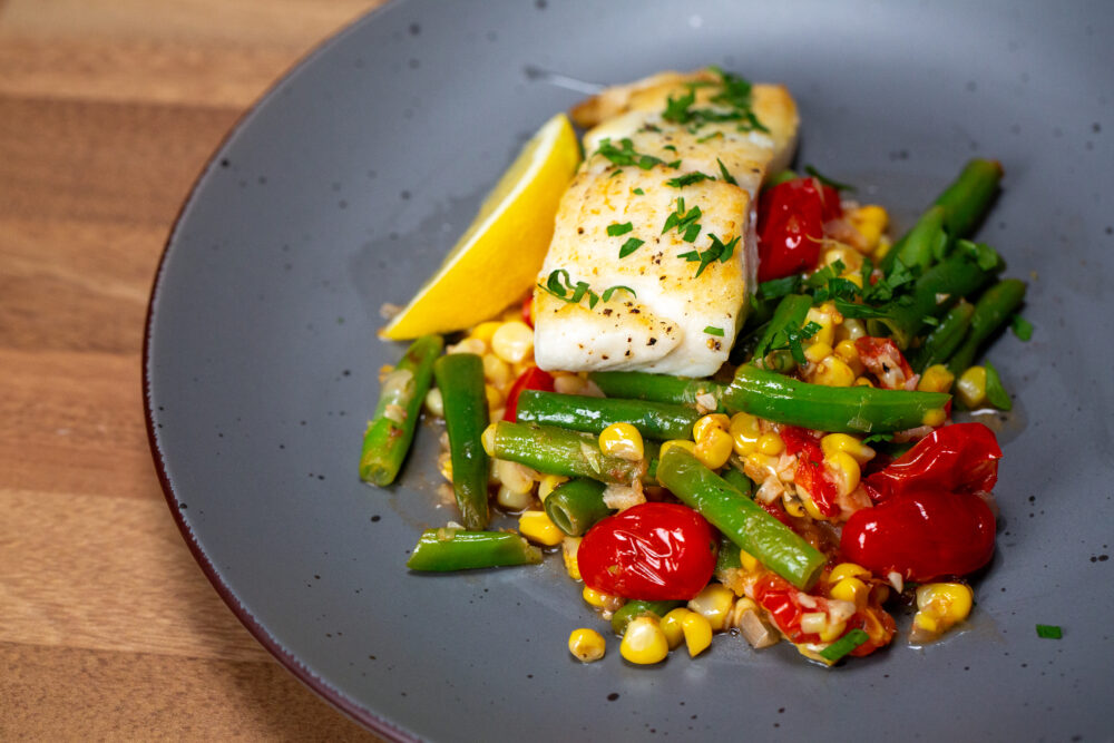 Succotash Halibut made with sweet summer and vine ripe tomatoes.
